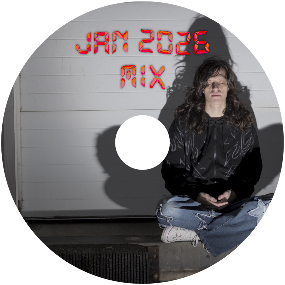 A digital master of the CD cover. It is me sitting in front of a truck receiving bay. My eyes are closed and I am sitting cross legged, in a meditative pose